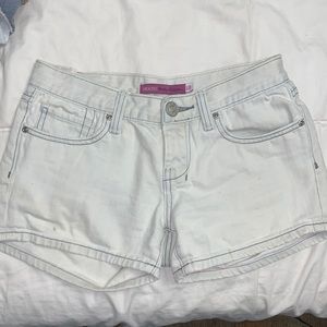Light wash jean shorts.